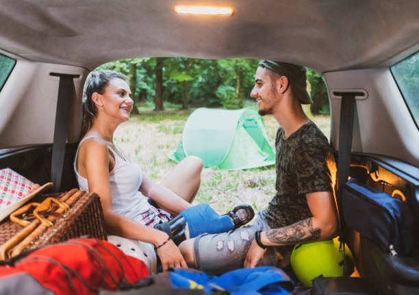 istock Young couple at road trip with car 1362244944