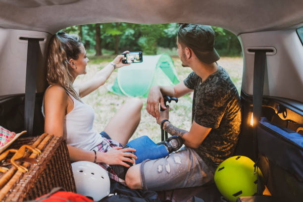 istock Young couple at road trip with car 1362244949
