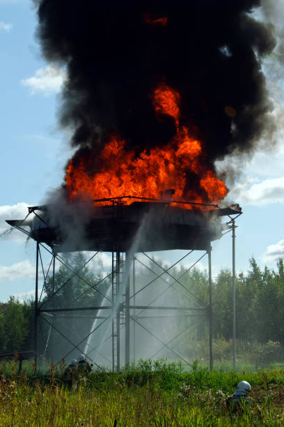 istock Firefighters extinguish a large fire at the factory. 1362255979