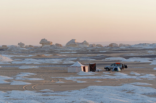 Picture of a tent and a car in the beautiful white desert in Egypt