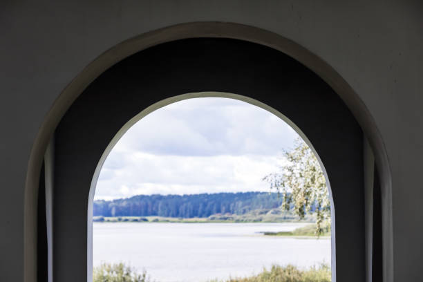 istock Abstract architectural background with summer landscape and an arch 1362258327