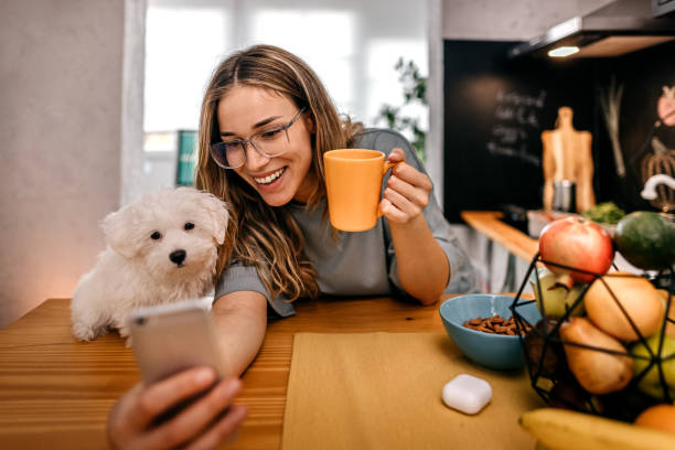 istock Women taking selfie with pet dog 1362263293