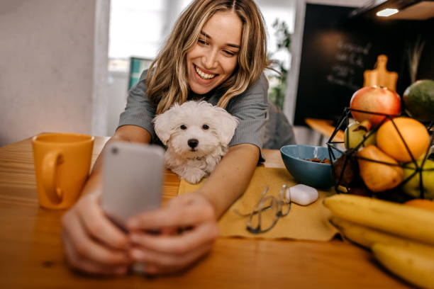 istock Women taking selfie with pet dog 1362263296