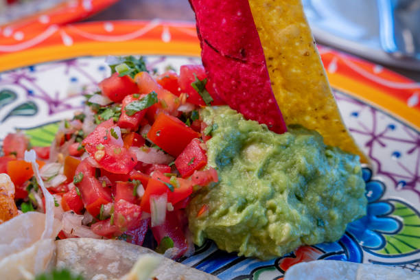 istock Authentic Salsa and Guacamole with Red and yellow corn chips on a festive plate in a Mexican Restaurant in Cabo San Lucas, Baja California Sur Mexico 1362263302