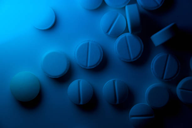 istock white medical pills are scattered on the table 1362263450