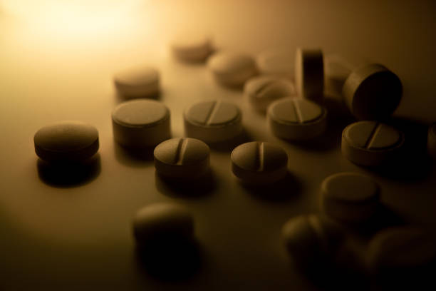 istock white medical pills are scattered on the table 1362263451
