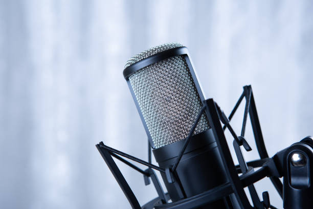 istock studio black condenser microphone against gray curtains 1362263469