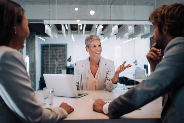 group of business persons talking in the office. - board room discussion contract agreement imagens e fotografias de stock