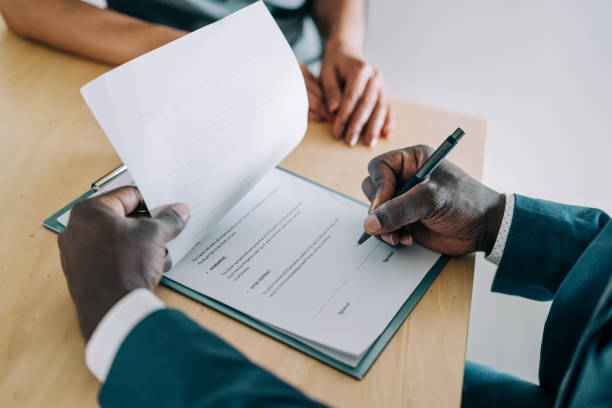 istock Business people signing a contract. 1362265079