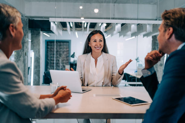 istock Group of business persons talking in the office. 1362265086