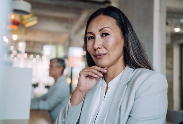 istock Confident businesswoman in modern office. 1362265156