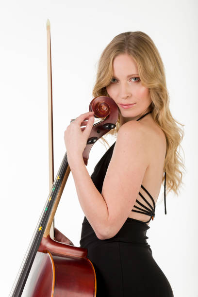 istock The viloncellist with her cello 1362266077