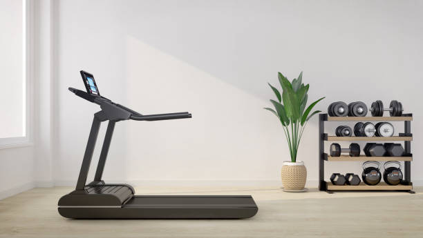 Treadmill in white room with dumbbell rack.3d rendering stock photo