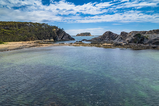 Guerilla Bay beach and inlet has calm waters and some of the oldest rock formations on the east coast of Australia. Taken on the South Coast of NSW, Australia.
