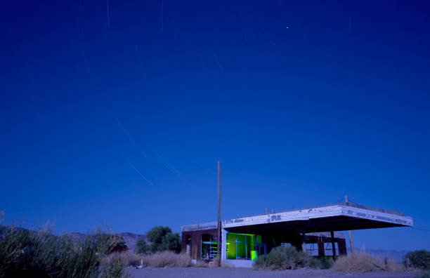 istock Abandoned Gas Station w/ green light painting inside 1362280573