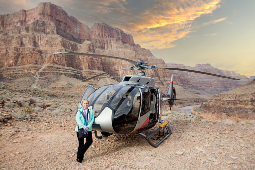 Tourists explore the north rim of the Grand Canyon with the assistance of a helicopter flight.