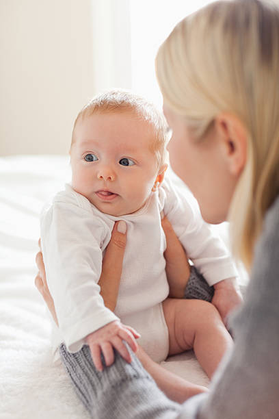 istock Mother holding her newborn 136228416