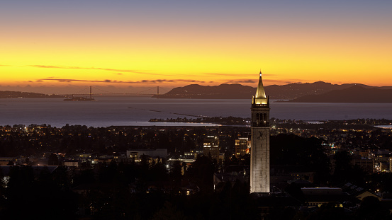 Twilight skies over Sather Tower of UC Berkeley via Big C Trail