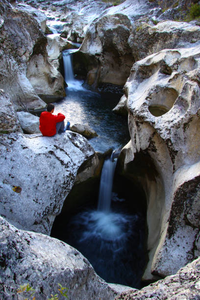 Man looking at waterfall, Horma Canyon, Kastamonu, Turkey stock photo