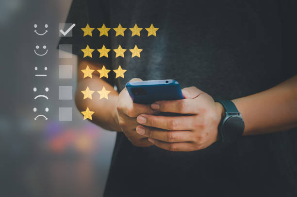 istock Customer Satisfaction Survey Concept Users rate the service experience on the online application. Customers can assess the quality of service.Hand holding smart phone. 1362287720