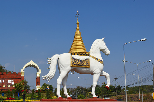 Symbol of Phrae, Den Chai District, Northwest Thailand, Horse Sculpture, historical Place at the Entrance to Phrae Province, Symbol of the Phrae Province, white male Horse, gilded octagonal Chedi on Horseback, Ornaments on the Side, Attraction, Point of Interest