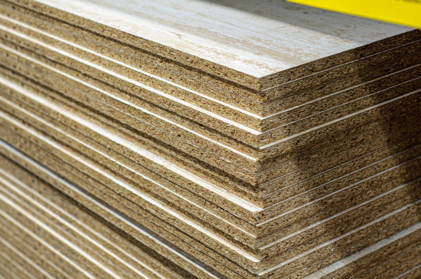 A pack of chipboard in the market for the manufacture of furniture. Lots of furniture boards stacked on a pallet A pack of chipboard in the market for the manufacture of furniture. Lots of furniture boards stacked on a pallet. pressboard stock pictures, royalty-free photos & images