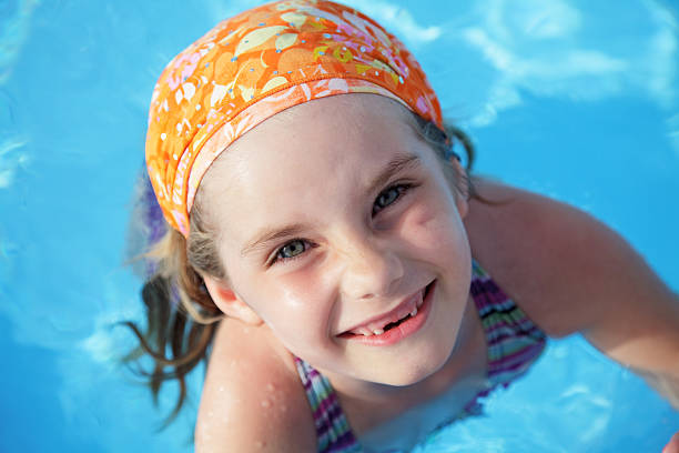 istock little girl in pool. 136229527