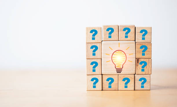 istock Drawing lightbulb print screen on wooden cube block among question mark for question and answer concept. 1362297494