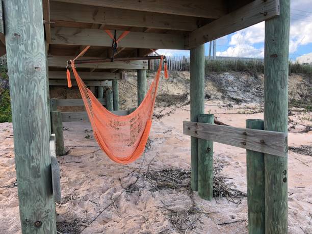 Inviting hammock chair at the beach stock photo