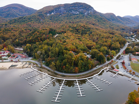 Docks on the waterfront of Lake Lure underneath the summit of Chimney Rock in the mountains of western North Carolina.