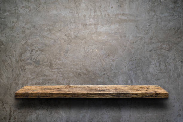 istock Wooden shelf over white concrete wall background. 1362301075