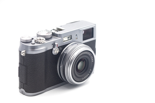 Vintage rangefinder camera 70s on white background.