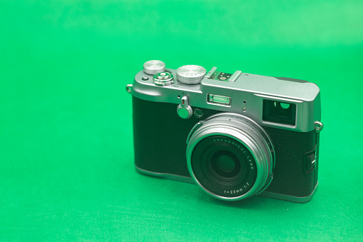 Retro Camera with Green Background