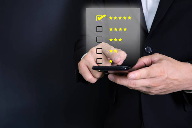 istock close up on customer man hand pressing on smartphone screen with gold five star rating 1362305769