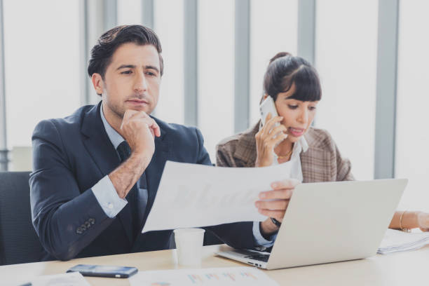 istock Businessman working thinking and consider marketing report plan with colleague 1362308049