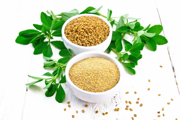 istock Fenugreek in two bowls with leaves on light board 1362309702
