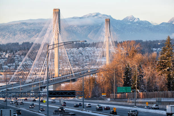 Port Mann Bridge at sunset, BC, Canada Port Mann Bridge at sunset in winter, Transcanada highway #1 at Surrey section, BC. surrey british columbia stock pictures, royalty-free photos & images