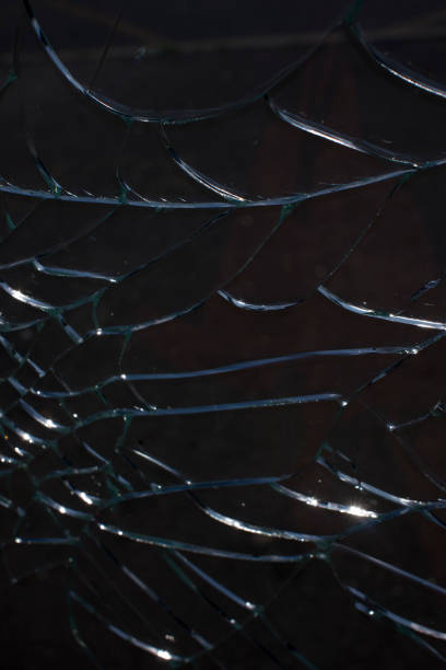 istock Broken glass over natural black background 1362312265
