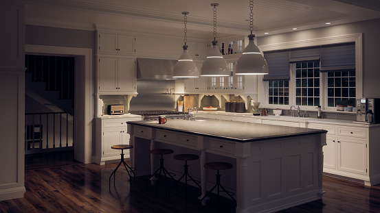 Cocina blanca ultra moderna con poca iluminación photo