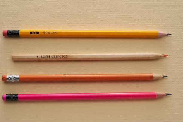 group of pencils on yellow background