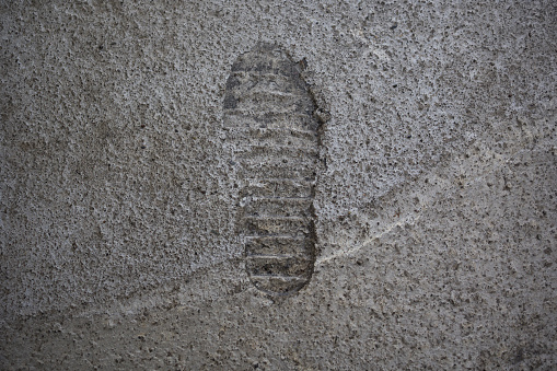 footprint in concrete , close up
