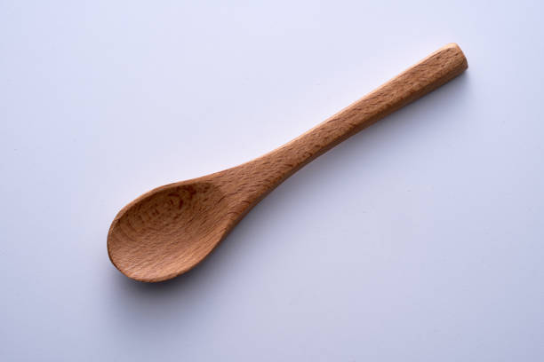 high angle view of wooden spoon on white background