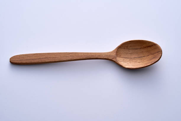 istock high angle view of wooden spoon on white background 1362323048