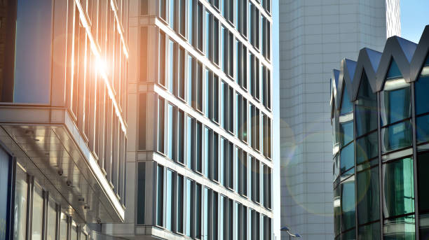istock Commercial building close up in blue tone. Gigantic skyscraper from below. 1362330312