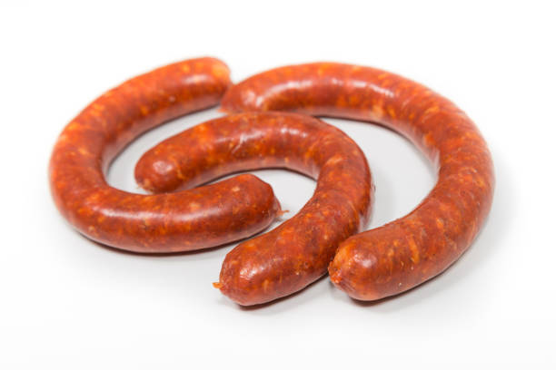 istock Three red chorizo crude sausages on a white background 1362331120