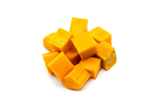 istock Carrot cubes isolated on white background 1362332619
