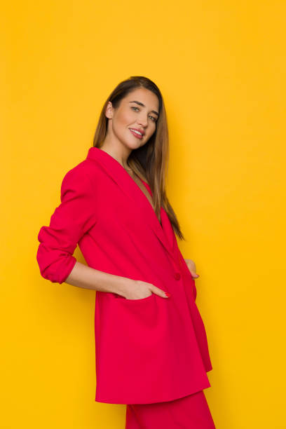 istock Cool young woman is posing in oversize red suit 1362333643