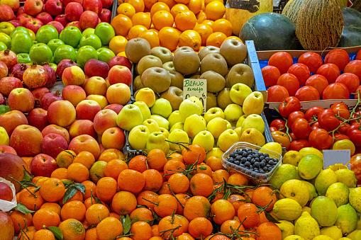 Apples and other fruits for sale at a market stall