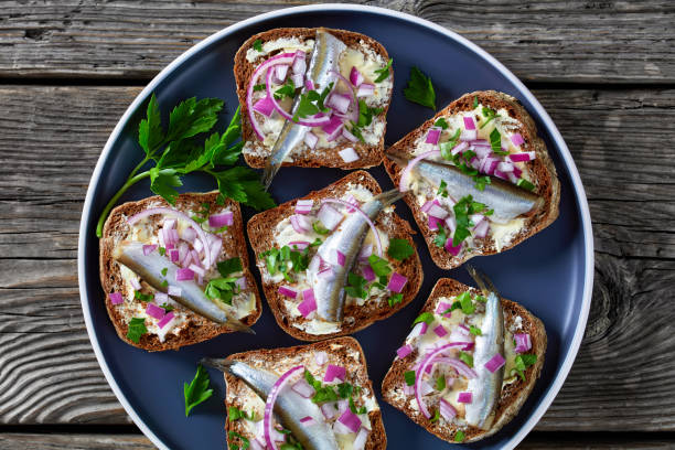 istock pickled sprat rye bread open sandwiches, top view 1362339931