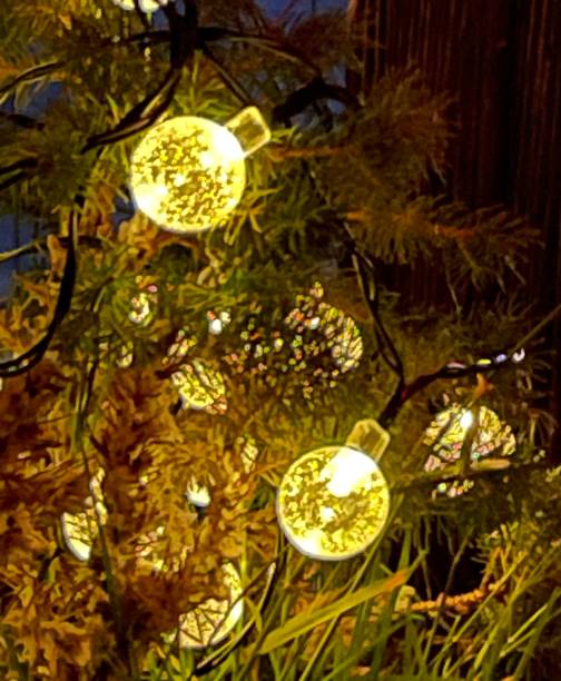istock illuminated LED Christmas tree balls in the tree 1362341630